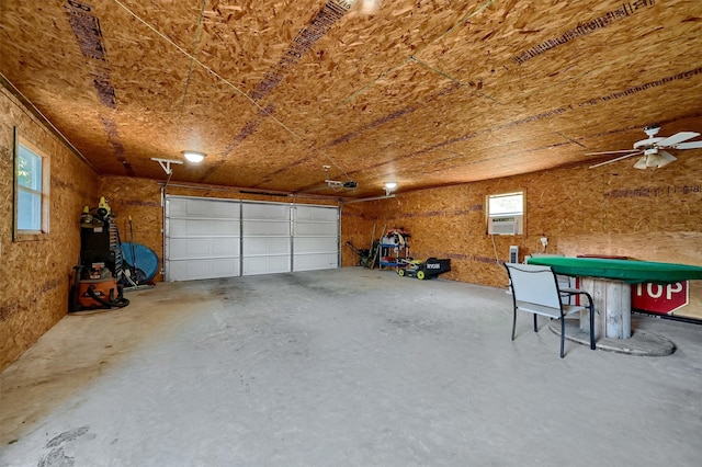 garage featuring ceiling fan and cooling unit