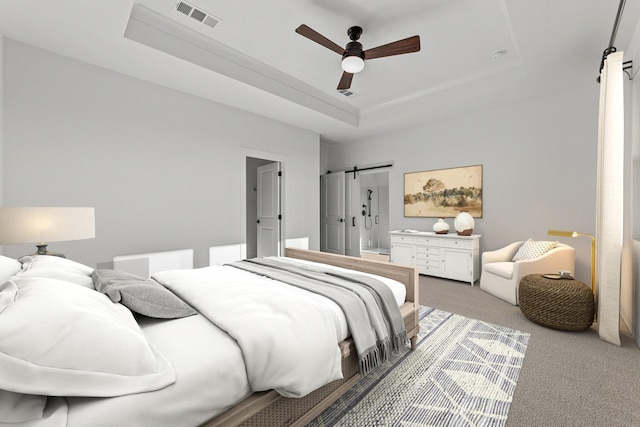 bedroom with ceiling fan, a barn door, a raised ceiling, and light carpet