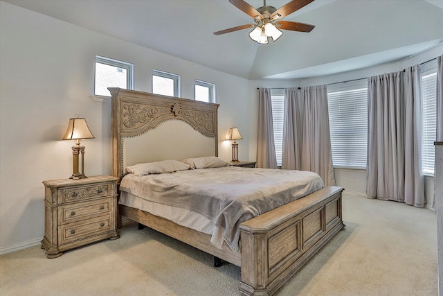 bedroom with light carpet, vaulted ceiling, and ceiling fan