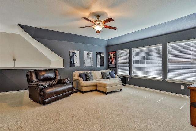 carpeted living room featuring ceiling fan