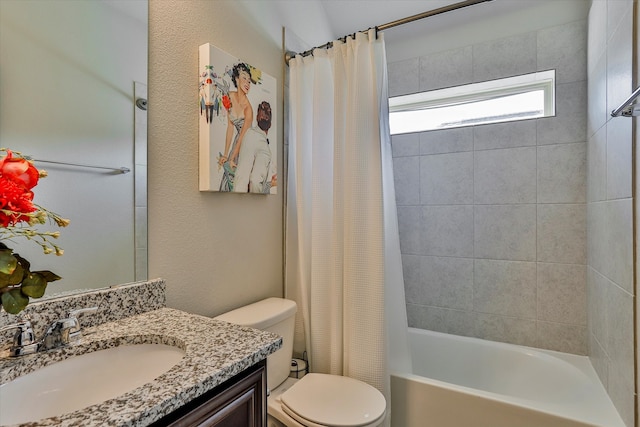 full bathroom featuring shower / bath combo, toilet, and vanity