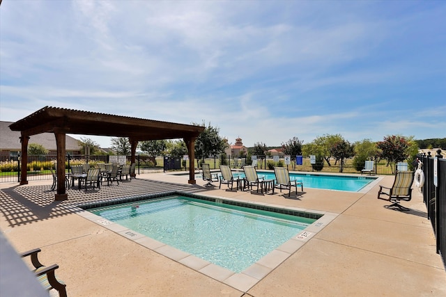 view of swimming pool with a pergola and a patio