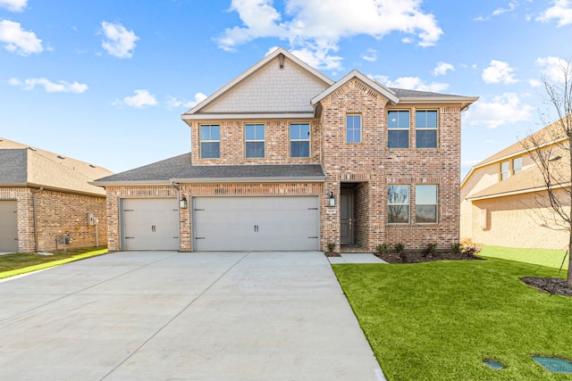 view of front of property with a front lawn and a garage