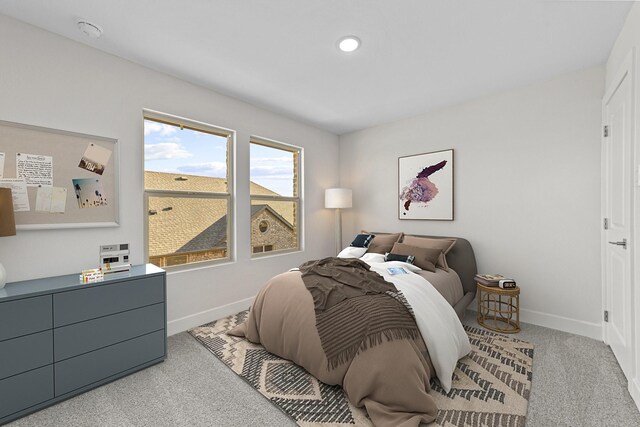 carpeted bedroom featuring recessed lighting and baseboards