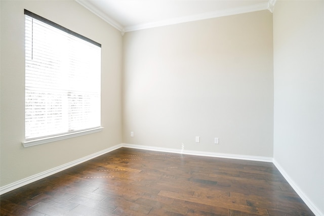 empty room featuring crown molding and dark hardwood / wood-style flooring