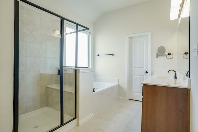 bathroom with vaulted ceiling, tile patterned flooring, vanity, and plus walk in shower