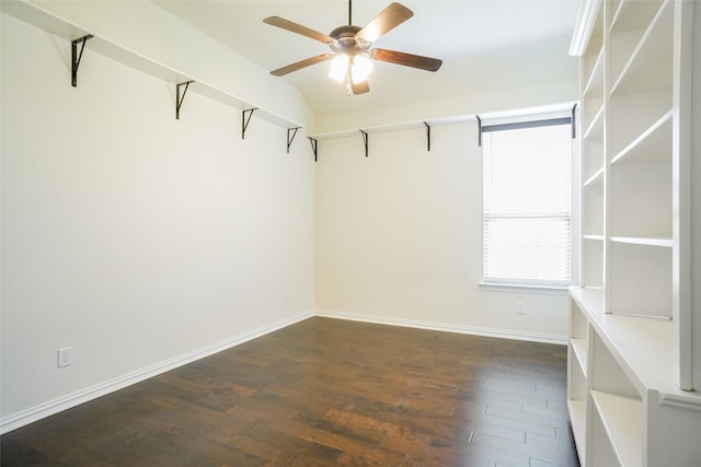 spare room featuring ceiling fan, vaulted ceiling, and dark hardwood / wood-style flooring