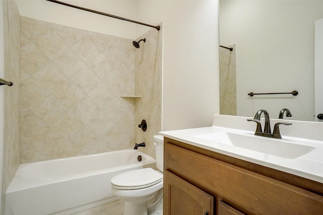 full bathroom featuring vanity, tiled shower / bath combo, and toilet