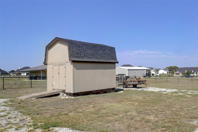 view of outbuilding with a lawn