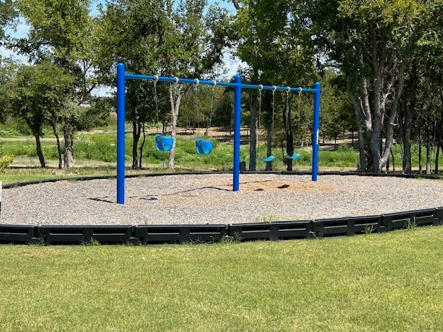 view of playground featuring a lawn