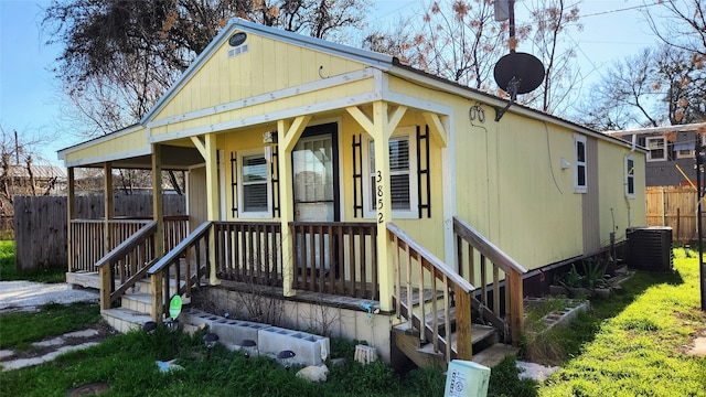 view of front of home with central air condition unit and covered porch