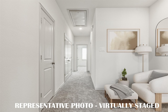 hallway featuring light carpet