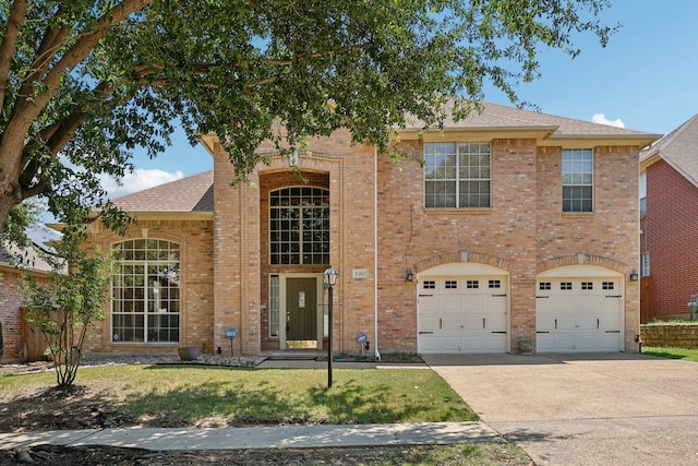 view of front facade featuring a garage and a front lawn