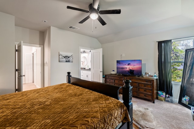 bedroom featuring a ceiling fan, lofted ceiling, visible vents, and light carpet