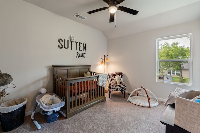 bedroom with carpet flooring, visible vents, vaulted ceiling, and baseboards