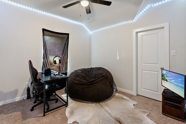 carpeted home office with ceiling fan