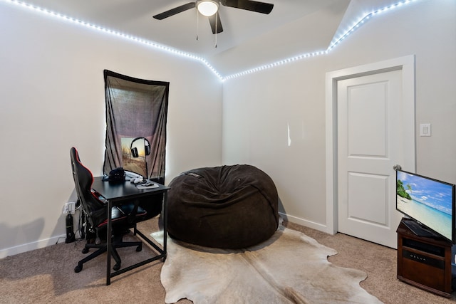 office area with a ceiling fan, carpet, and baseboards