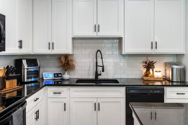 kitchen featuring white cabinetry, sink, and tasteful backsplash