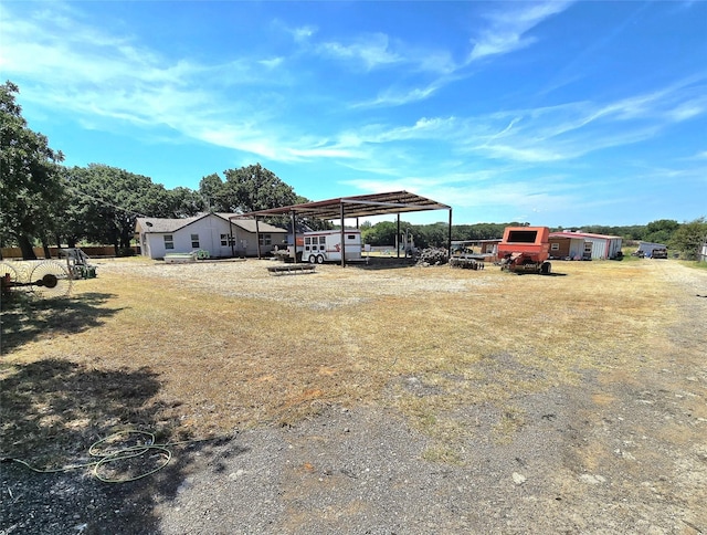 view of yard featuring a carport