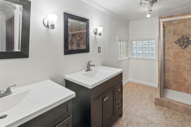 full bath with two vanities, ornamental molding, a stall shower, and a sink