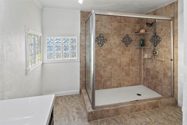 full bathroom featuring a shower stall, a textured wall, and ornamental molding