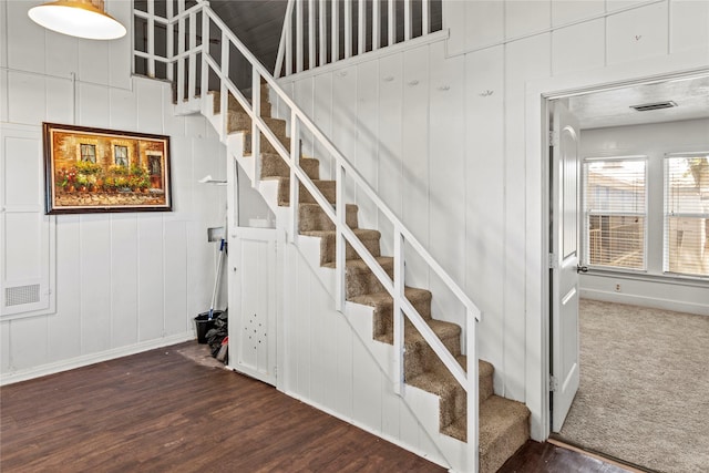 stairs with baseboards and wood finished floors