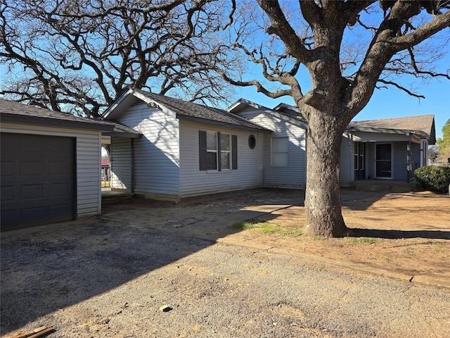 view of side of property featuring a garage