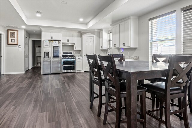 bedroom featuring recessed lighting, visible vents, baseboards, and wood finished floors