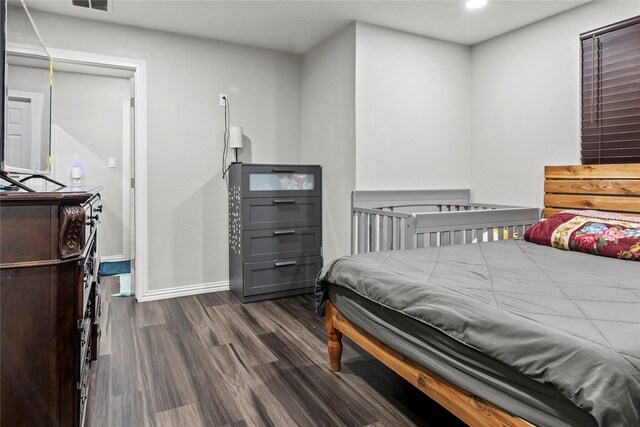 bedroom featuring recessed lighting, wood finished floors, and baseboards