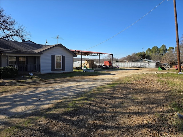 view of home's exterior with a carport