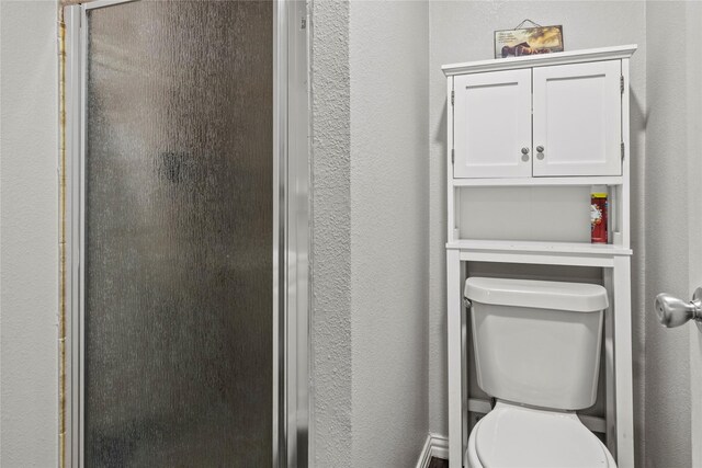 bathroom with vanity and a textured wall