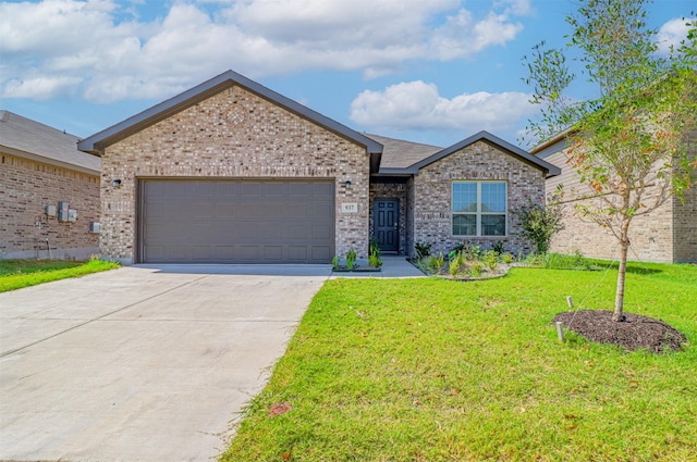 ranch-style home featuring brick siding, an attached garage, concrete driveway, and a front lawn