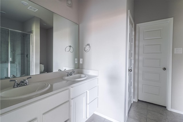 full bathroom with a sink, visible vents, a stall shower, and tile patterned floors