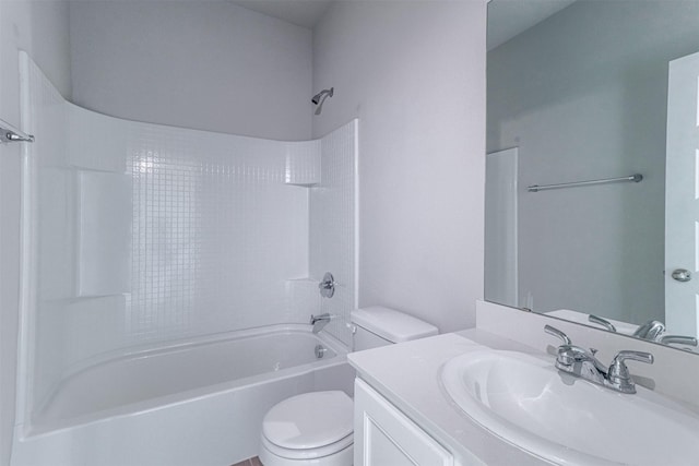 bathroom featuring shower / washtub combination, toilet, and vanity