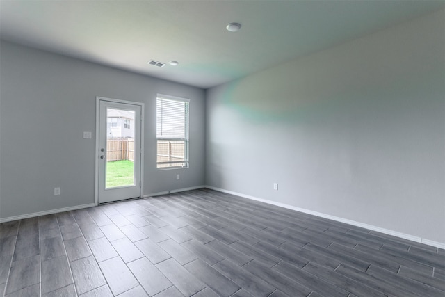 unfurnished room featuring hardwood / wood-style flooring