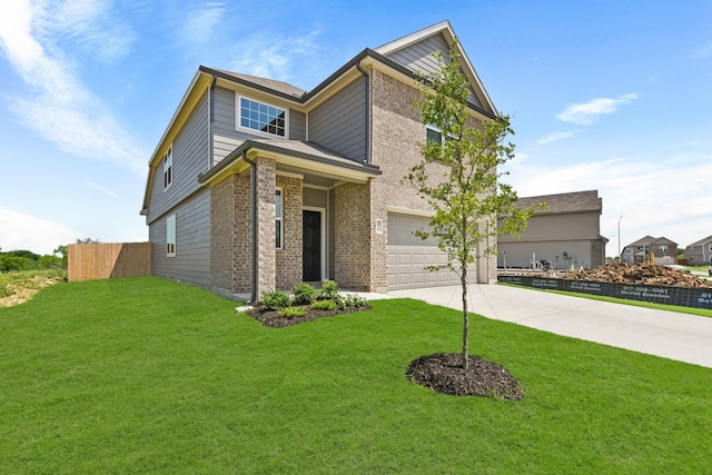 traditional-style home with driveway, an attached garage, fence, a front lawn, and brick siding