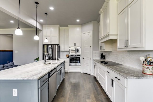 kitchen featuring sink, hanging light fixtures, stainless steel appliances, tasteful backsplash, and crown molding