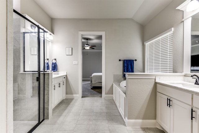 bathroom with ceiling fan, vanity, walk in shower, and tile patterned floors