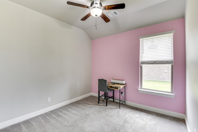 carpeted spare room featuring ceiling fan and vaulted ceiling