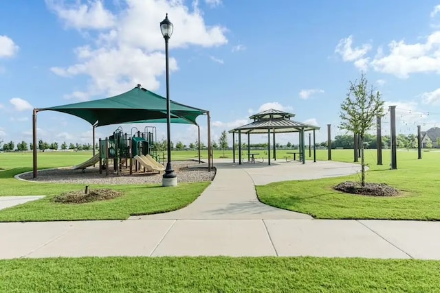 view of home's community featuring a gazebo, a playground, and a lawn