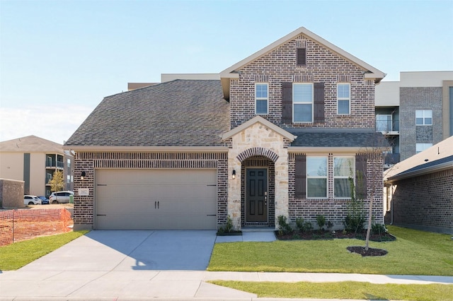 view of front of house with a garage and a front yard