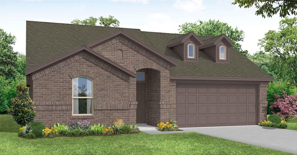 view of front of home with a garage and a front lawn