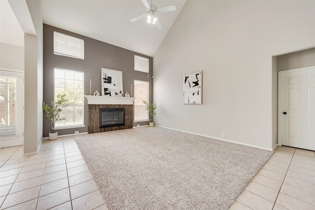 tiled living room with high vaulted ceiling and ceiling fan