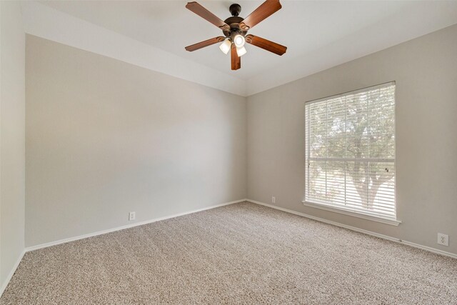 unfurnished room featuring ceiling fan and carpet floors