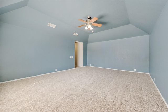 additional living space with ceiling fan, vaulted ceiling, and carpet floors