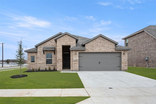 view of front of house with a garage and a front yard