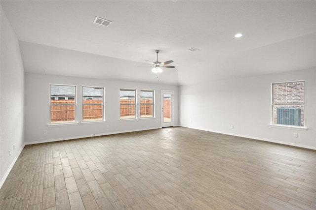 unfurnished room featuring light hardwood / wood-style flooring, ceiling fan, and vaulted ceiling