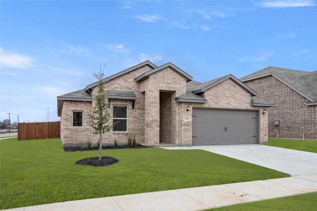 single story home with a garage and a front yard