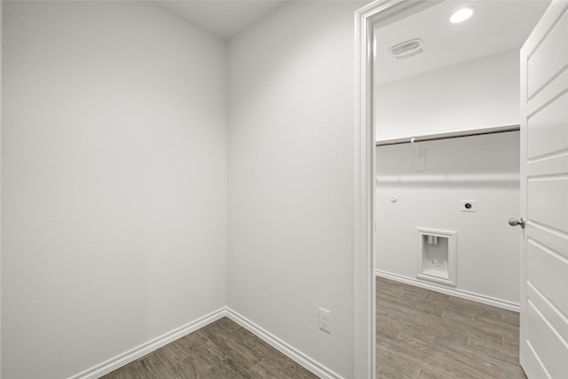 laundry area featuring hookup for an electric dryer, hookup for a gas dryer, and hardwood / wood-style floors