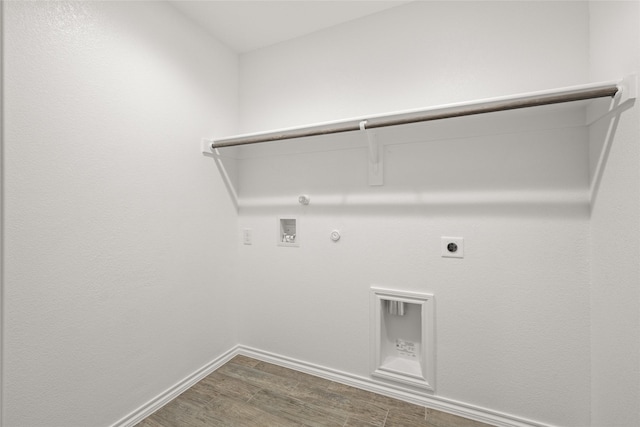 laundry area featuring gas dryer hookup, washer hookup, dark wood-type flooring, and hookup for an electric dryer